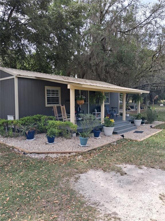 10360 County Road 18 Lake Butler, FL 32054 - Photo 42 of 43 a front view of a house with garden