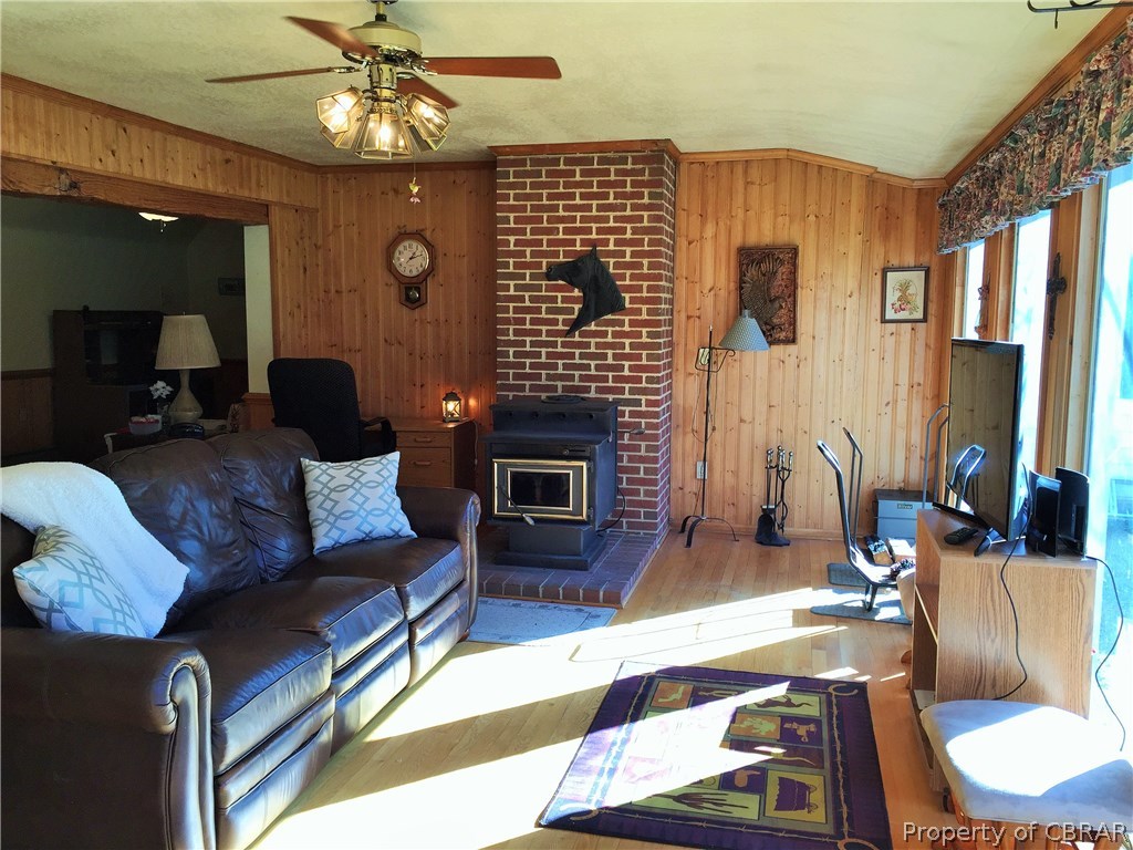 15 Mill Wharf Road Wake, VA 23176 - Photo 15 of 31 Family room with woodburning stove, lots of windows and access to the deck.