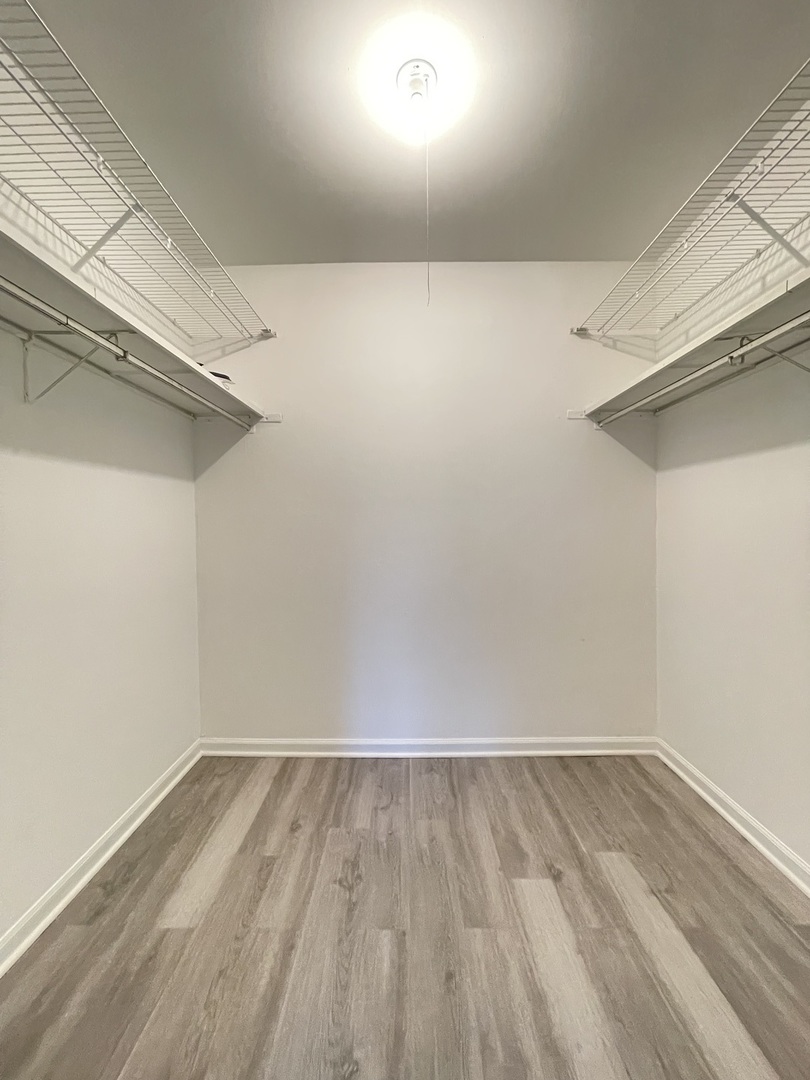 248 East Bailey Road, Unit K Naperville, IL 60565 - Photo 11 of 13 a view of a room with wooden floor
