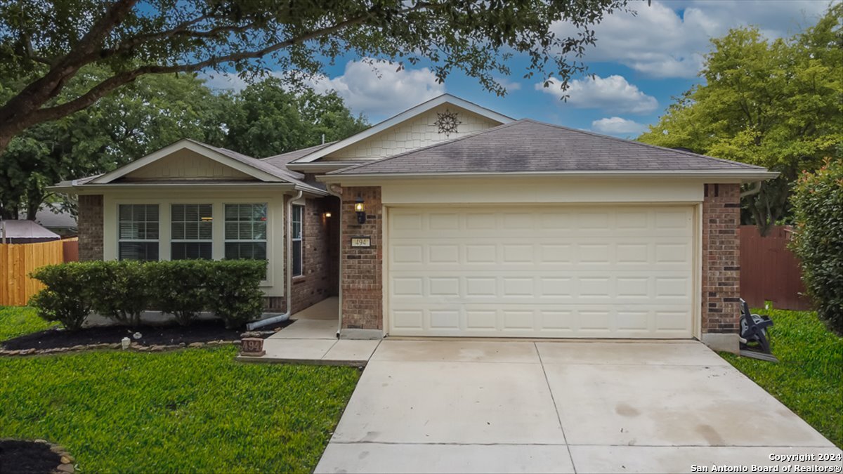 494 Rooster Run Schertz, TX 78154 - Photo 1 of 1 a front view of a house with a yard and garage