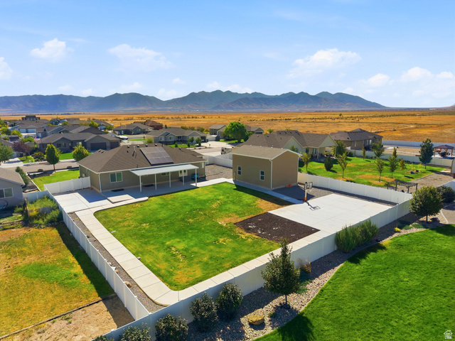 664 South Saddle Road Grantsville, UT 84029 - Photo 2 of 39 1/2 acre lot with riding track, game court and covered patio!