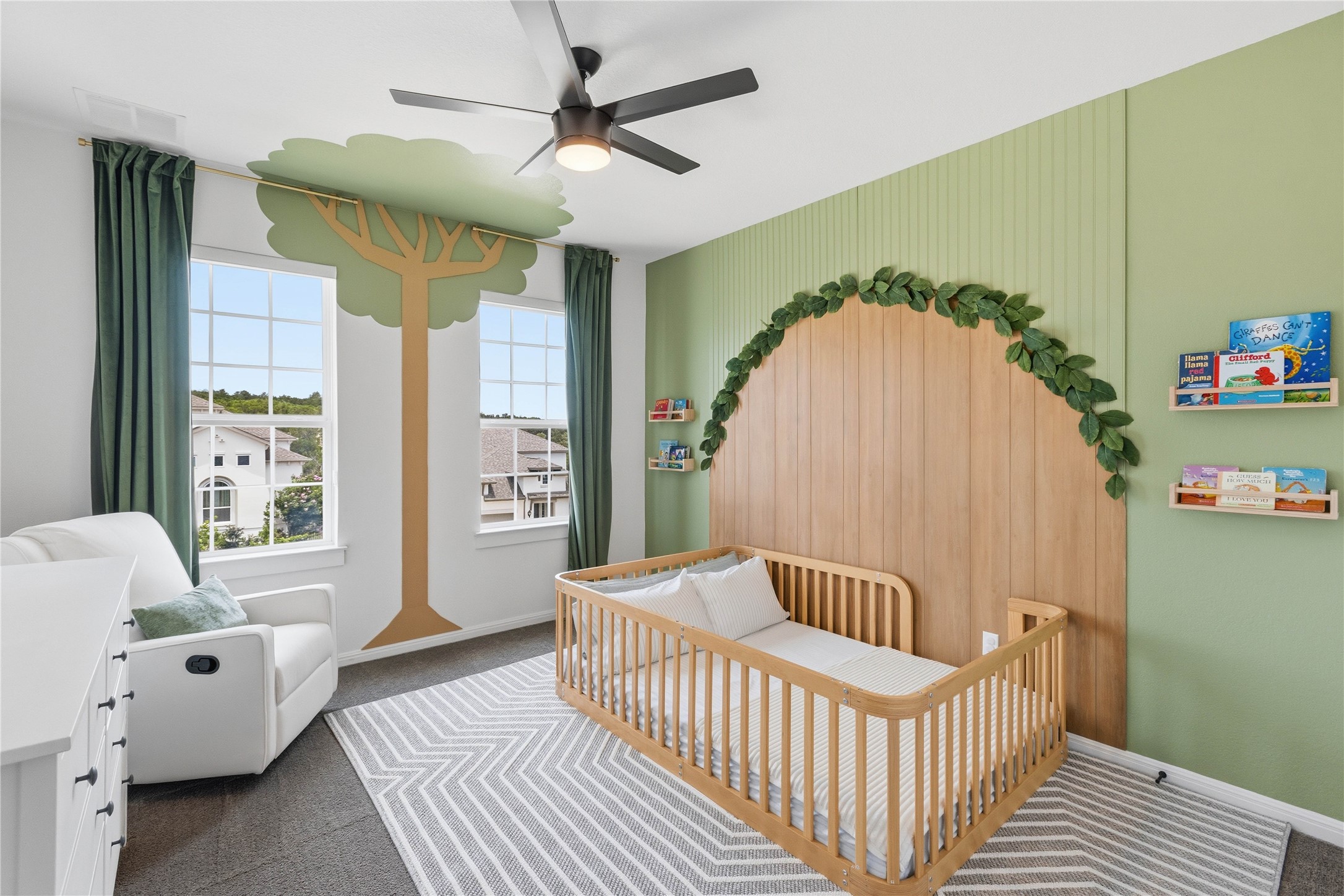 836 Villa Rialto View Leander, TX 78641 - Photo 28 of 33 A delightful bedroom with a creative tree mural and inviting natural light.
