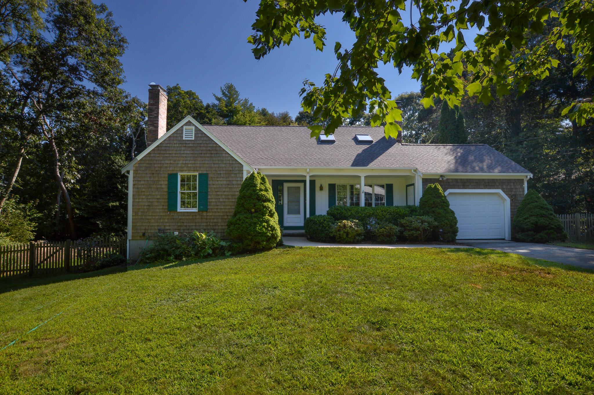 33 Cameron Road North Falmouth, MA 02556 - Photo 1 of 22 a front view of a house with a garden