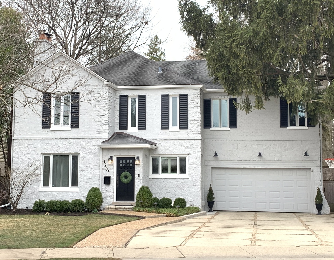 1207 Ridge Road Wilmette, IL 60091 - Photo 1 of 1 a front view of a house with a yard