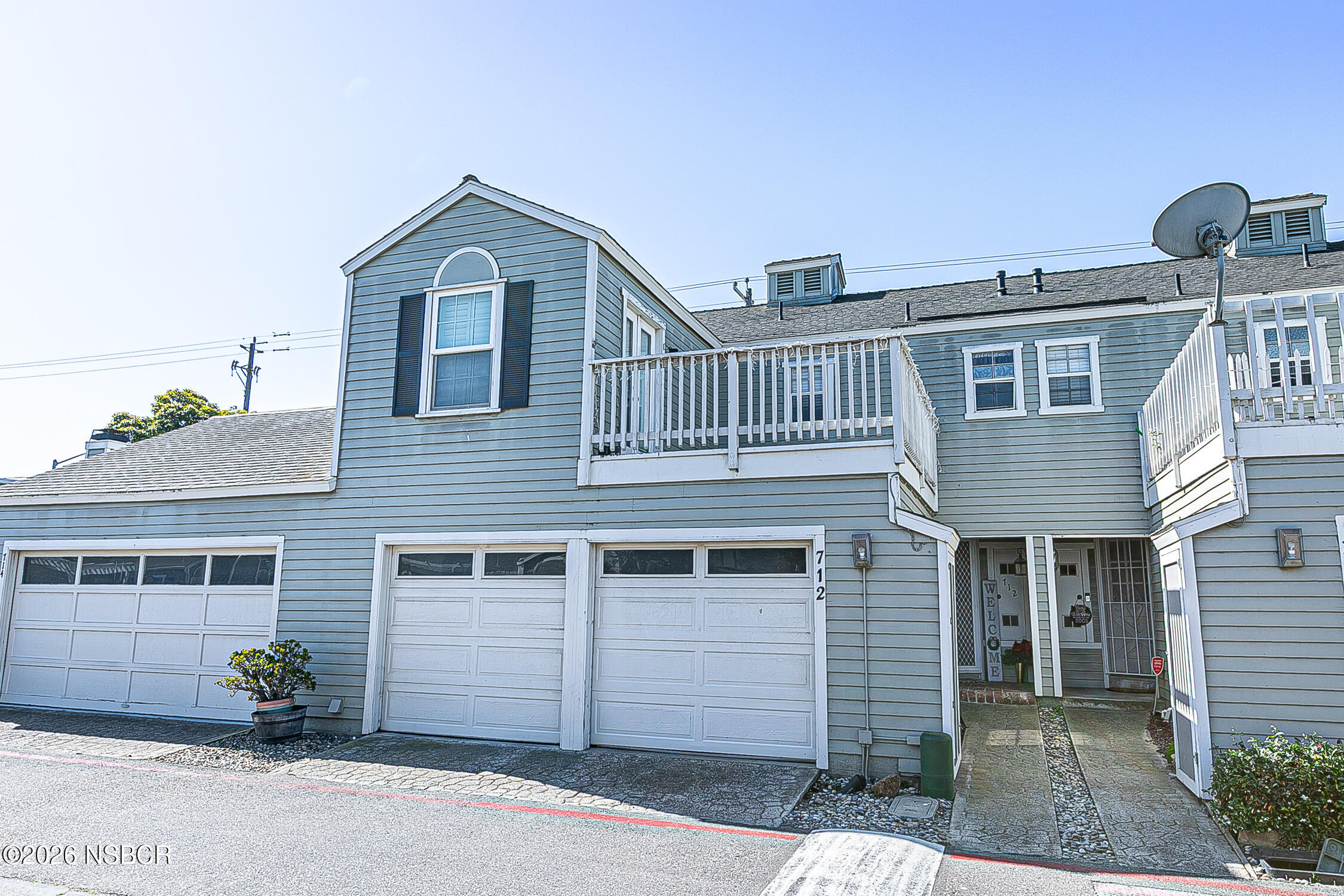 712 Pebble Beach Place Santa Maria, CA 93454 - Photo 2 of 31 a front view of a house with a yard and garage