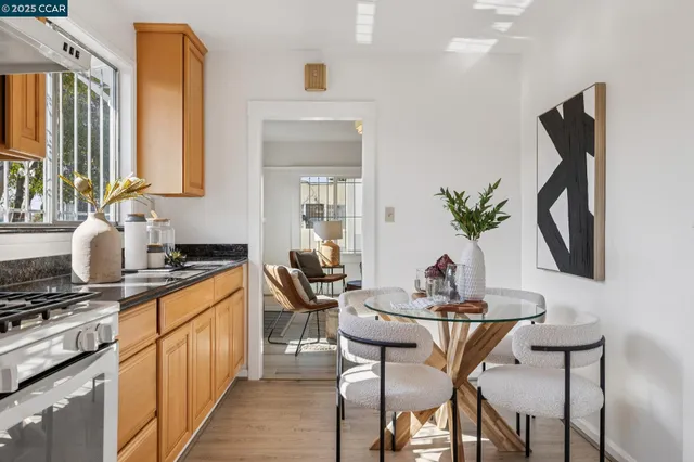 a dining room with furniture and wooden floor