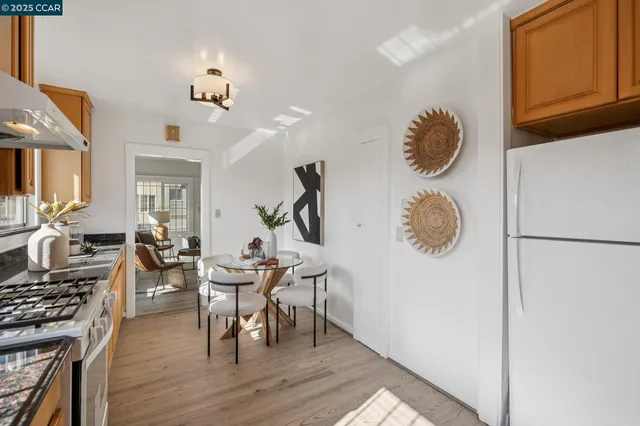 a view of dining room and kitchen with wooden floor