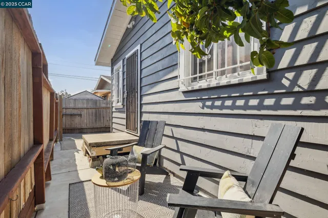 a view of a chairs and table in a balcony