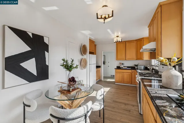 a living room with furniture a dining table and kitchen view