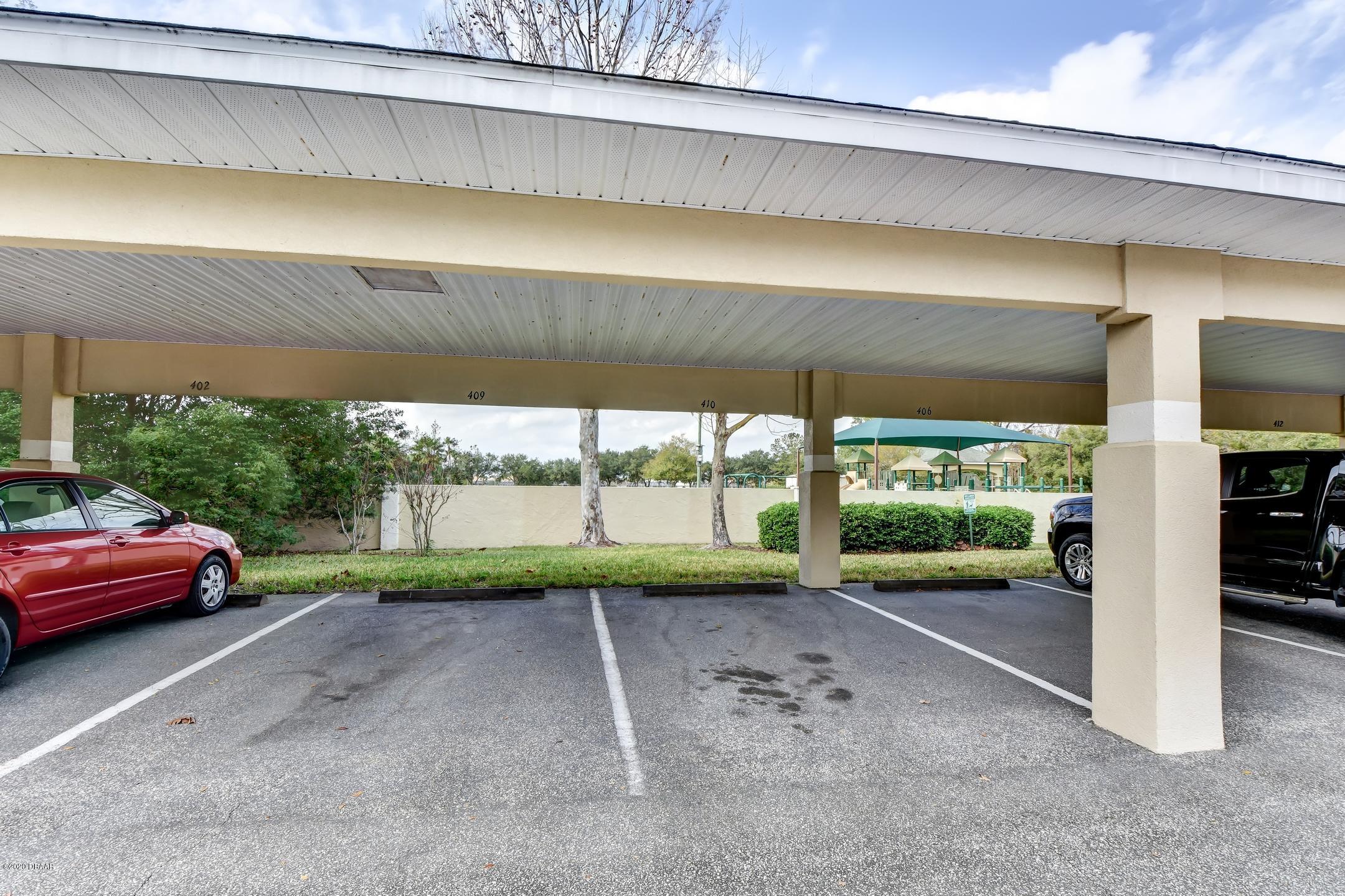 830 Airport Road, Unit 410 Port Orange, FL 32128 - Photo 21 of 26 32-Covered Parking