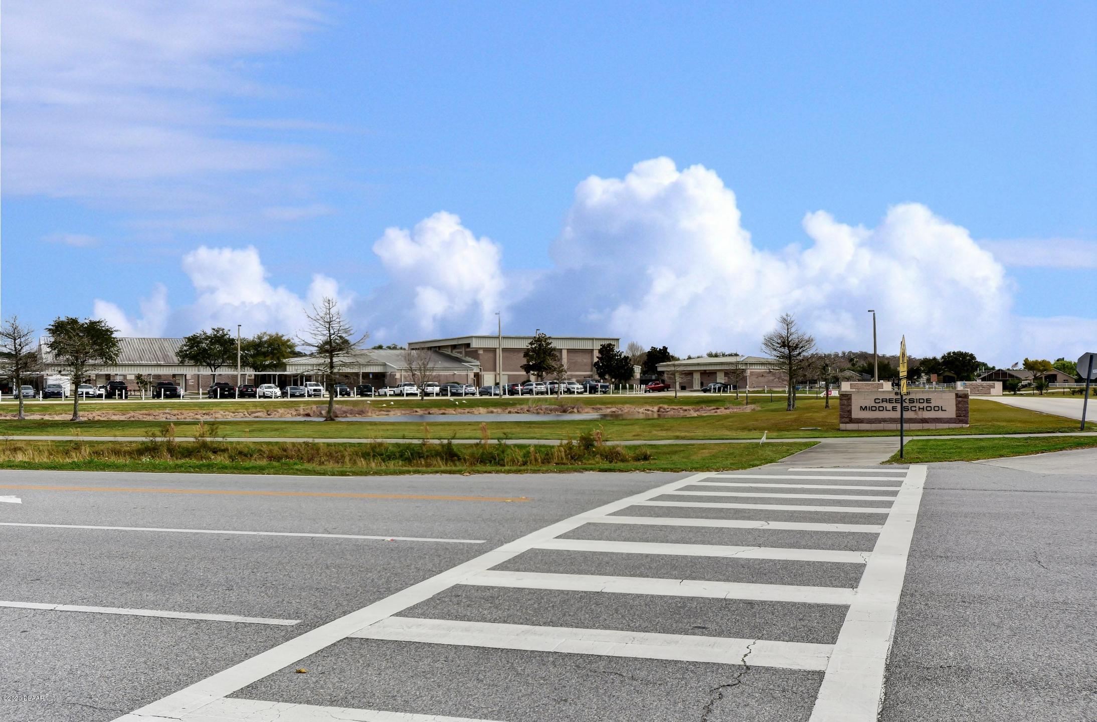 830 Airport Road, Unit 410 Port Orange, FL 32128 - Photo 26 of 26 38-Local School Across Street
