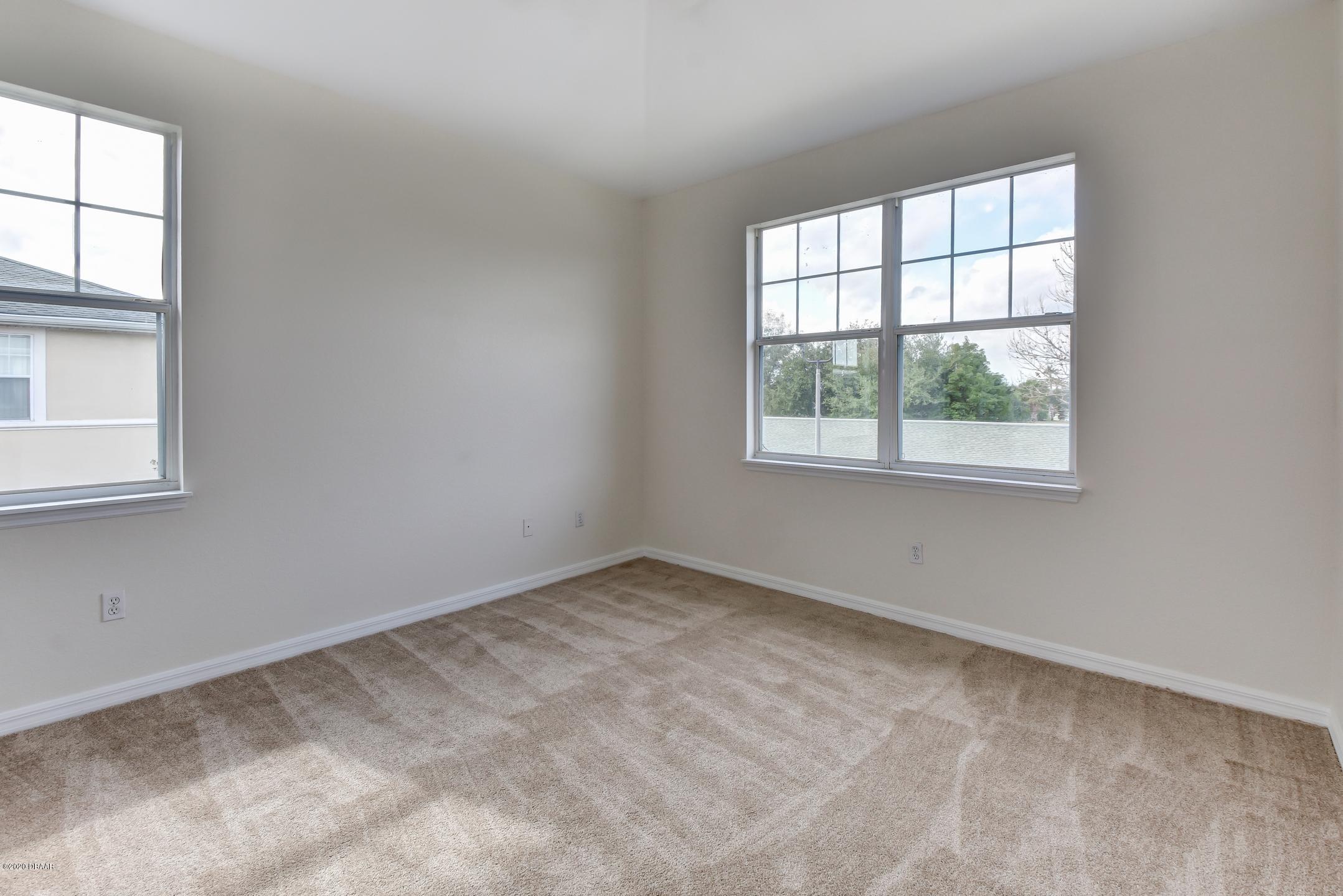 830 Airport Road, Unit 410 Port Orange, FL 32128 - Photo 7 of 26 10-Master Bedroom