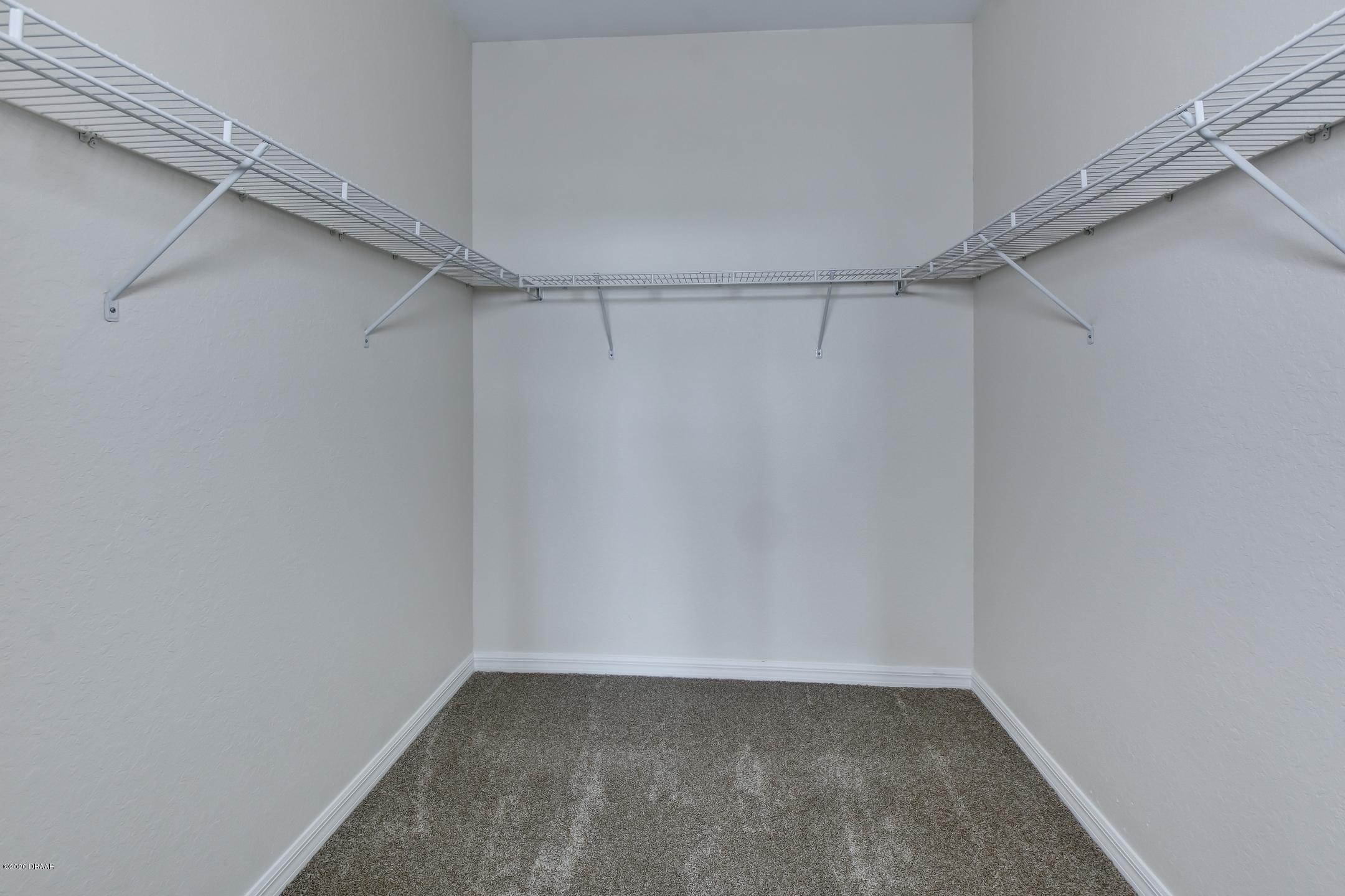 830 Airport Road, Unit 410 Port Orange, FL 32128 - Photo 8 of 26 13-Master Walk-in Closet