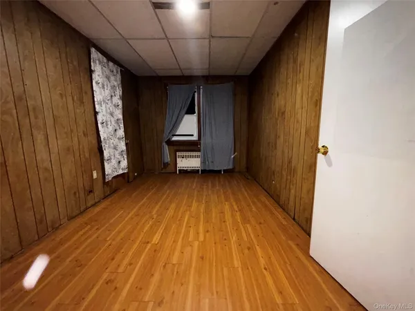 a view of front door with wooden floor