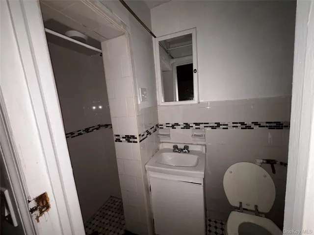 a bathroom with a toilet and a sink