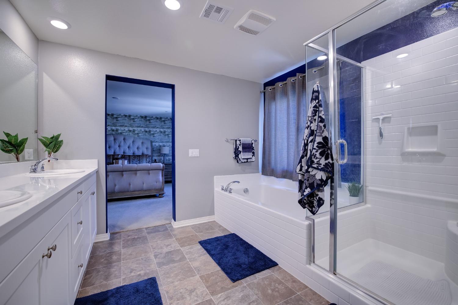 26055 Plumcot Drive Corona, CA 92883 - Photo 11 of 47 a very nice looking room with a couch a sink a potted plant and a rug