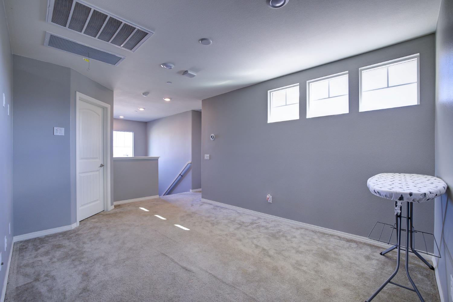 26055 Plumcot Drive Corona, CA 92883 - Photo 14 of 47 a view of an empty room with a window