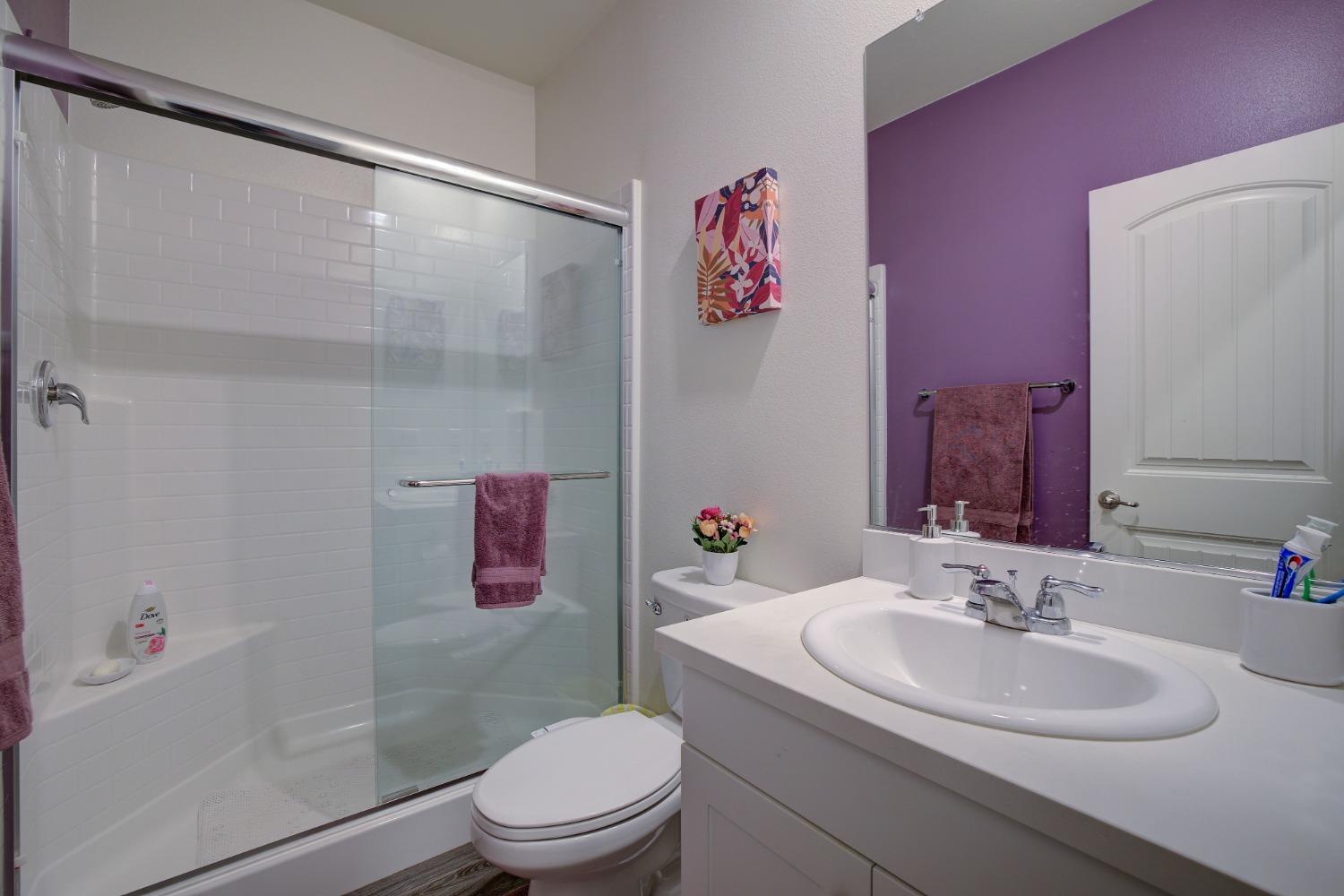 26055 Plumcot Drive Corona, CA 92883 - Photo 16 of 47 a bathroom with a sink mirror vanity and toilet