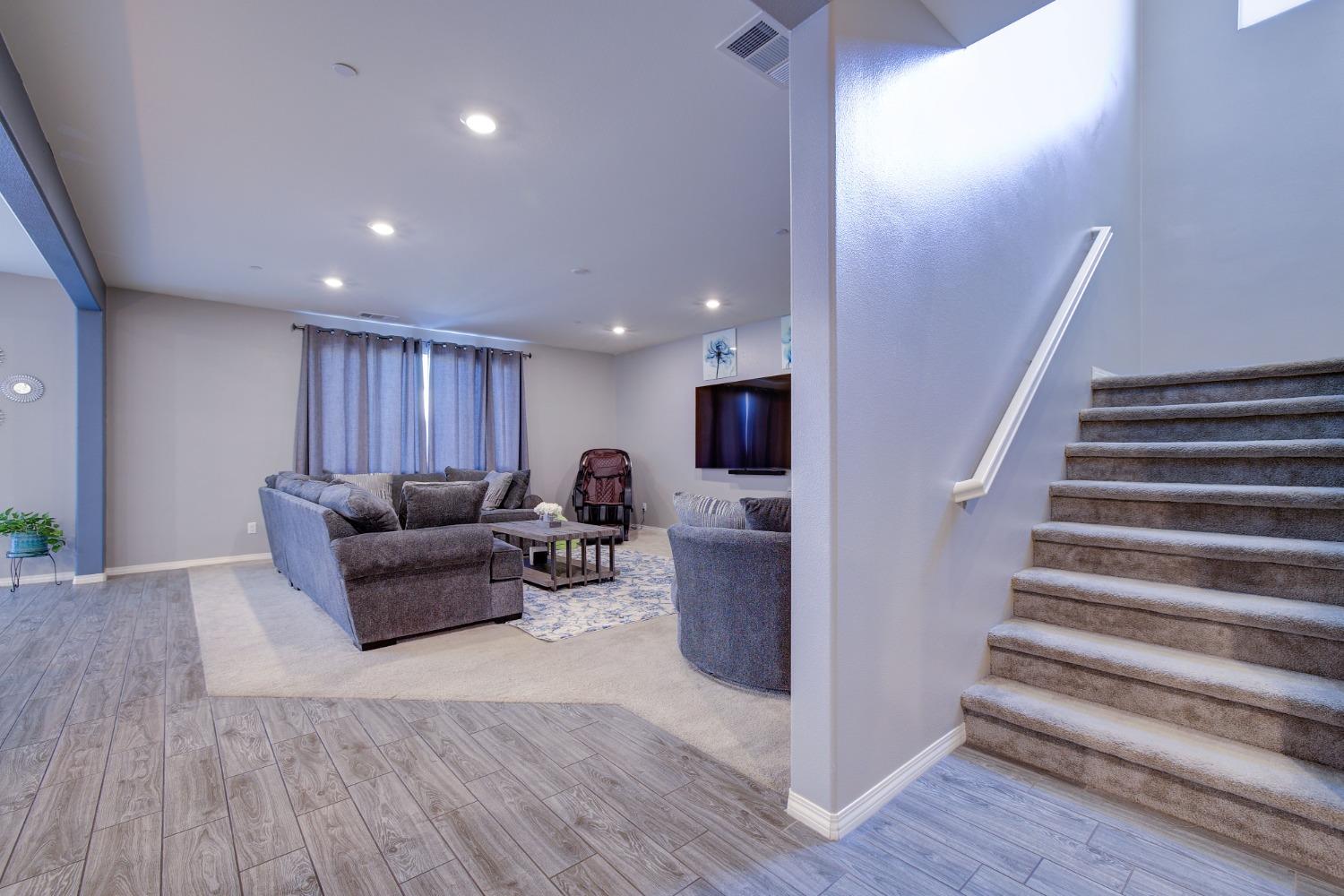 26055 Plumcot Drive Corona, CA 92883 - Photo 17 of 47 a living room with furniture and a wooden floor