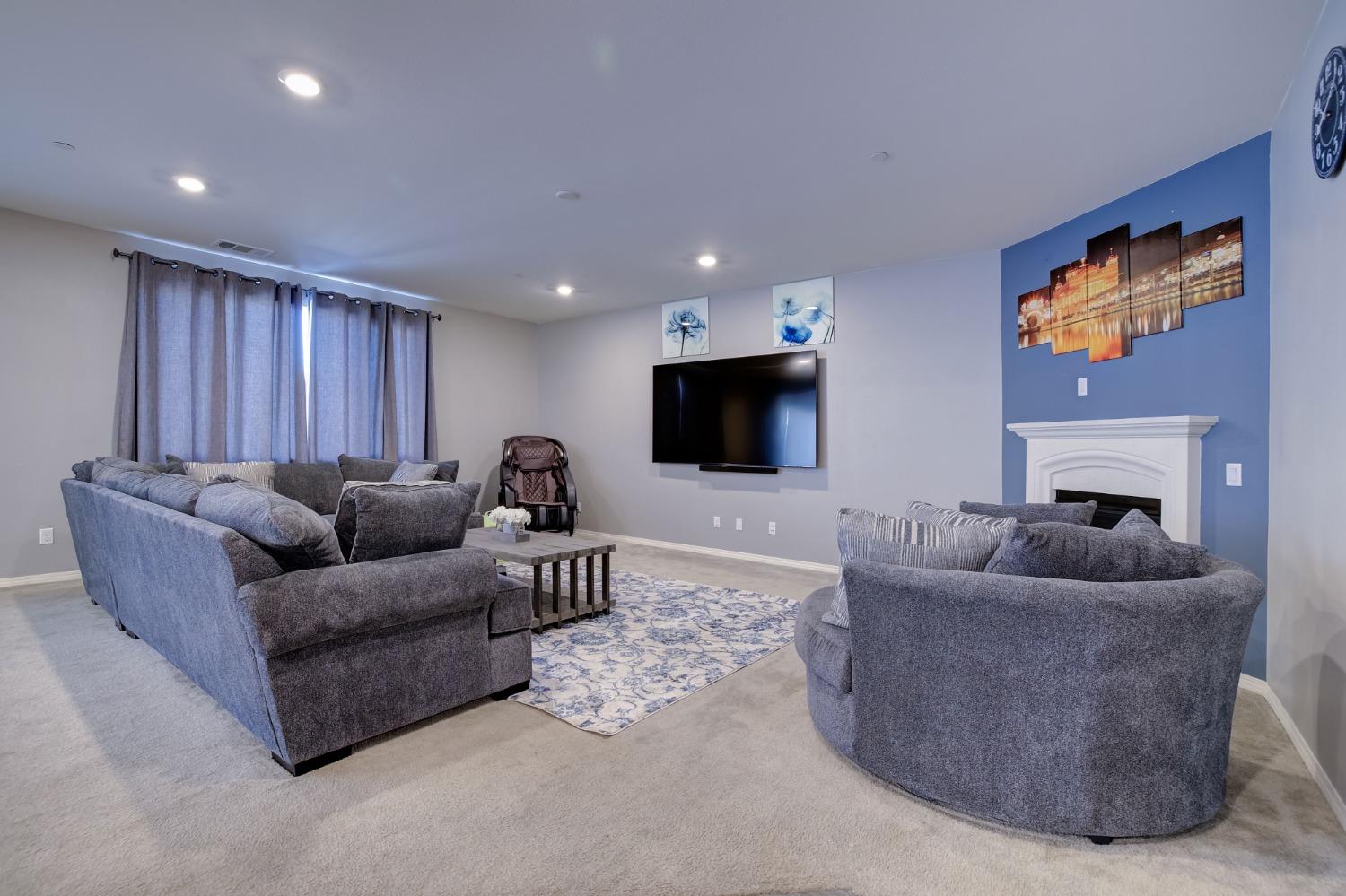 26055 Plumcot Drive Corona, CA 92883 - Photo 18 of 47 a living room with furniture and a flat screen tv