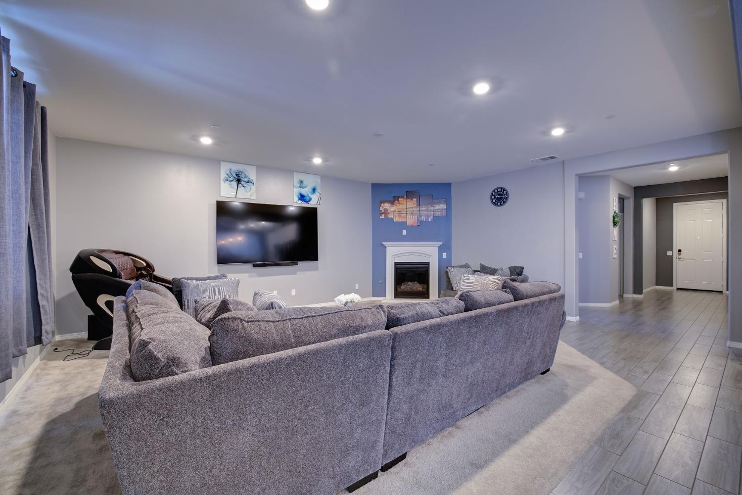 26055 Plumcot Drive Corona, CA 92883 - Photo 20 of 47 a living room with furniture and a flat screen tv