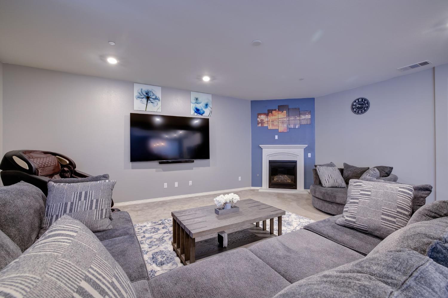 26055 Plumcot Drive Corona, CA 92883 - Photo 21 of 47 a living room with furniture and a flat screen tv