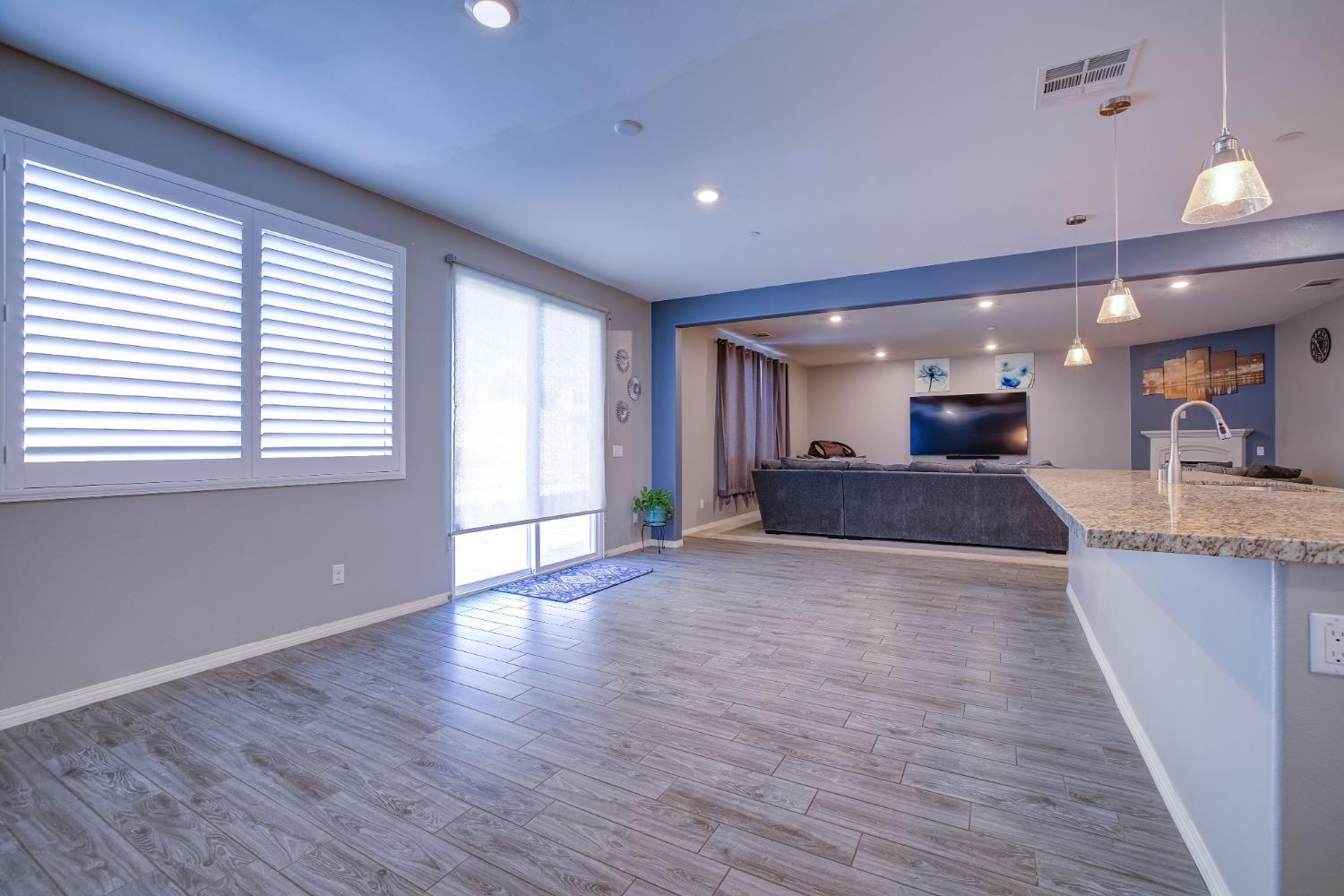26055 Plumcot Drive Corona, CA 92883 - Photo 28 of 47 a view of a big room with wooden floor and a window
