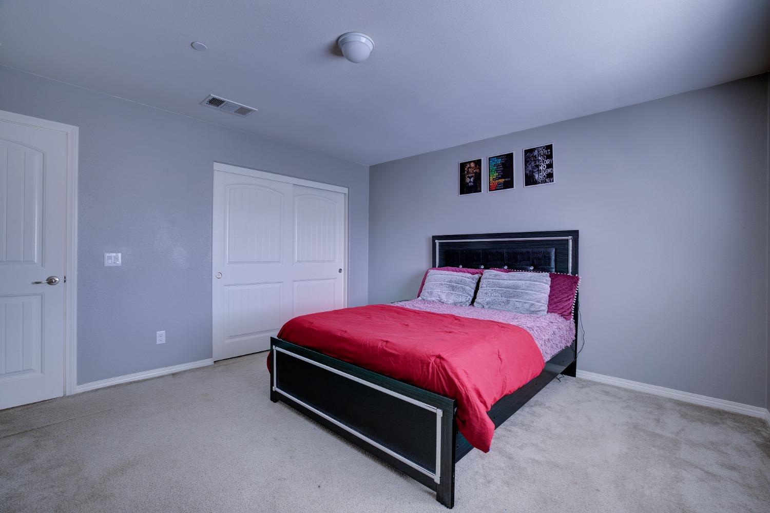 26055 Plumcot Drive Corona, CA 92883 - Photo 34 of 47 a bed room with a bed and a lamp