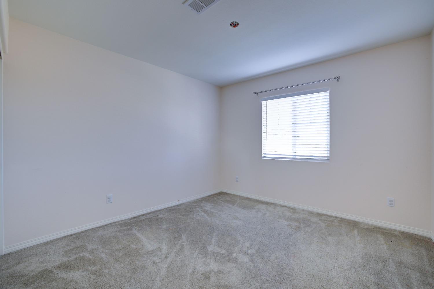 26055 Plumcot Drive Corona, CA 92883 - Photo 37 of 47 an empty room with a window