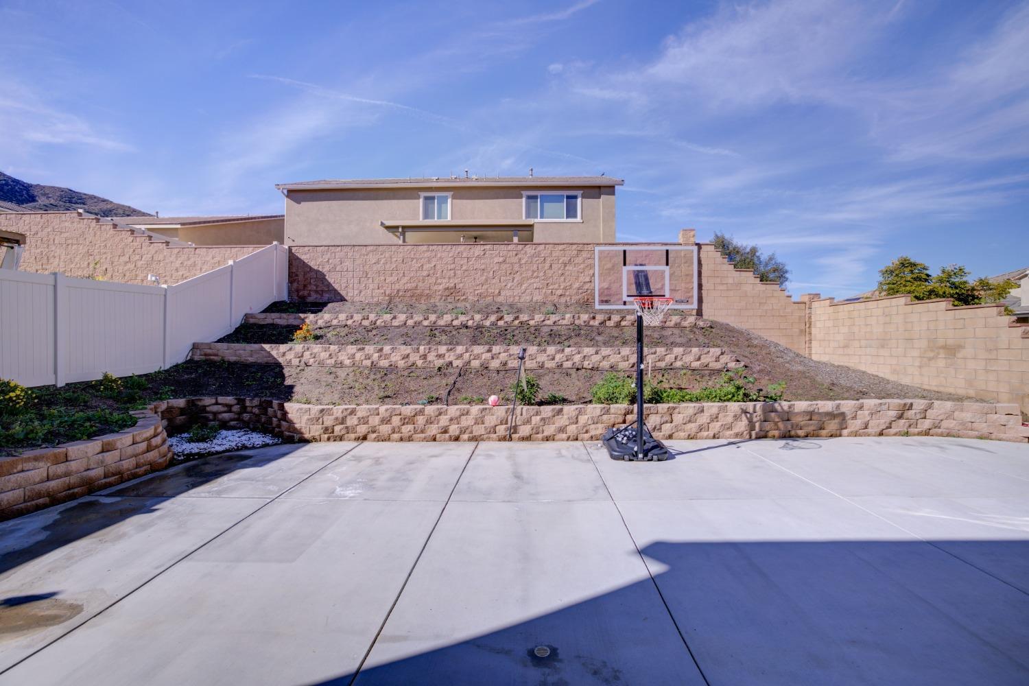 26055 Plumcot Drive Corona, CA 92883 - Photo 46 of 47 a front view of a house with a yard