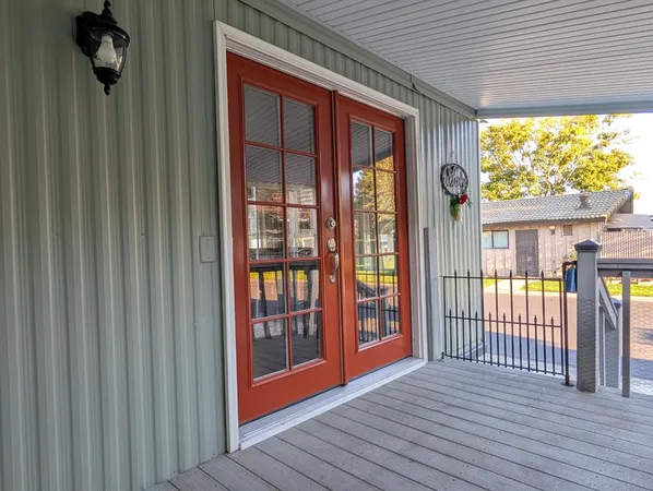 a view of front door deck and living room