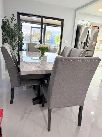 a view of a livingroom with furniture and window