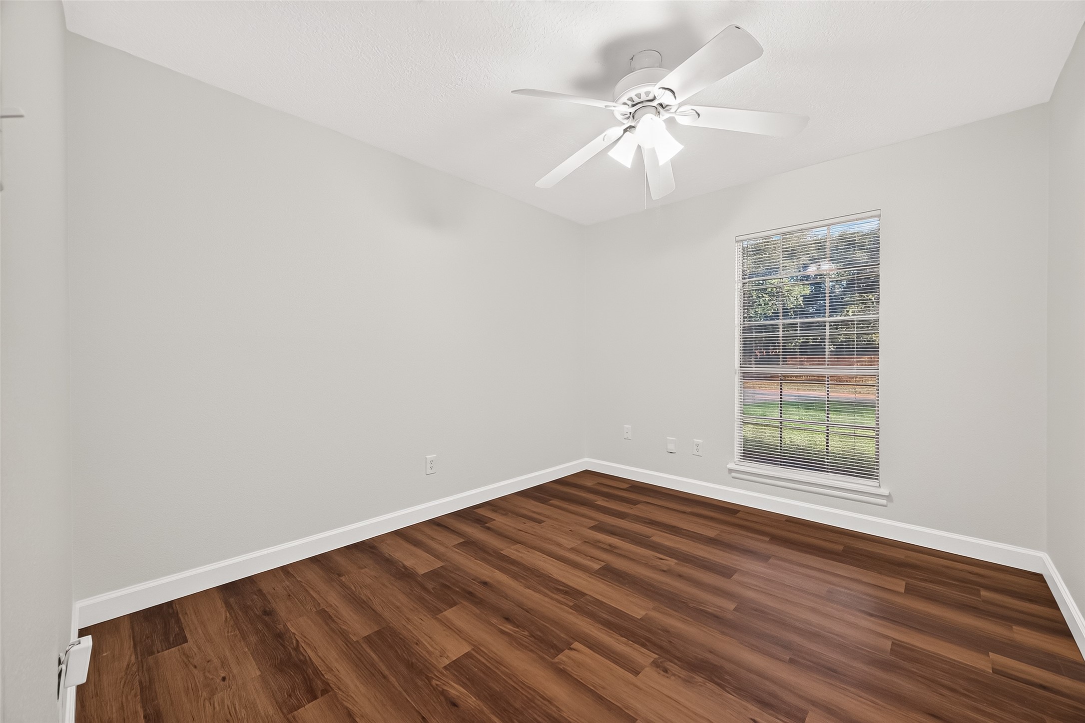 9322 Magnolia Ridge Drive Houston, TX 77070 - Photo 6 of 16 First secondary bedroom freshly painted, new floors, and new blinds.
