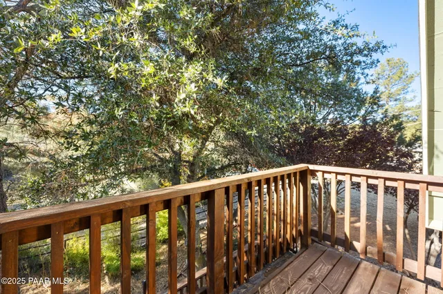 a view of balcony with wooden floor