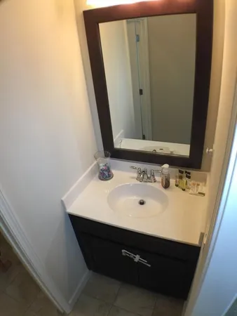 a bathroom with a sink and a mirror