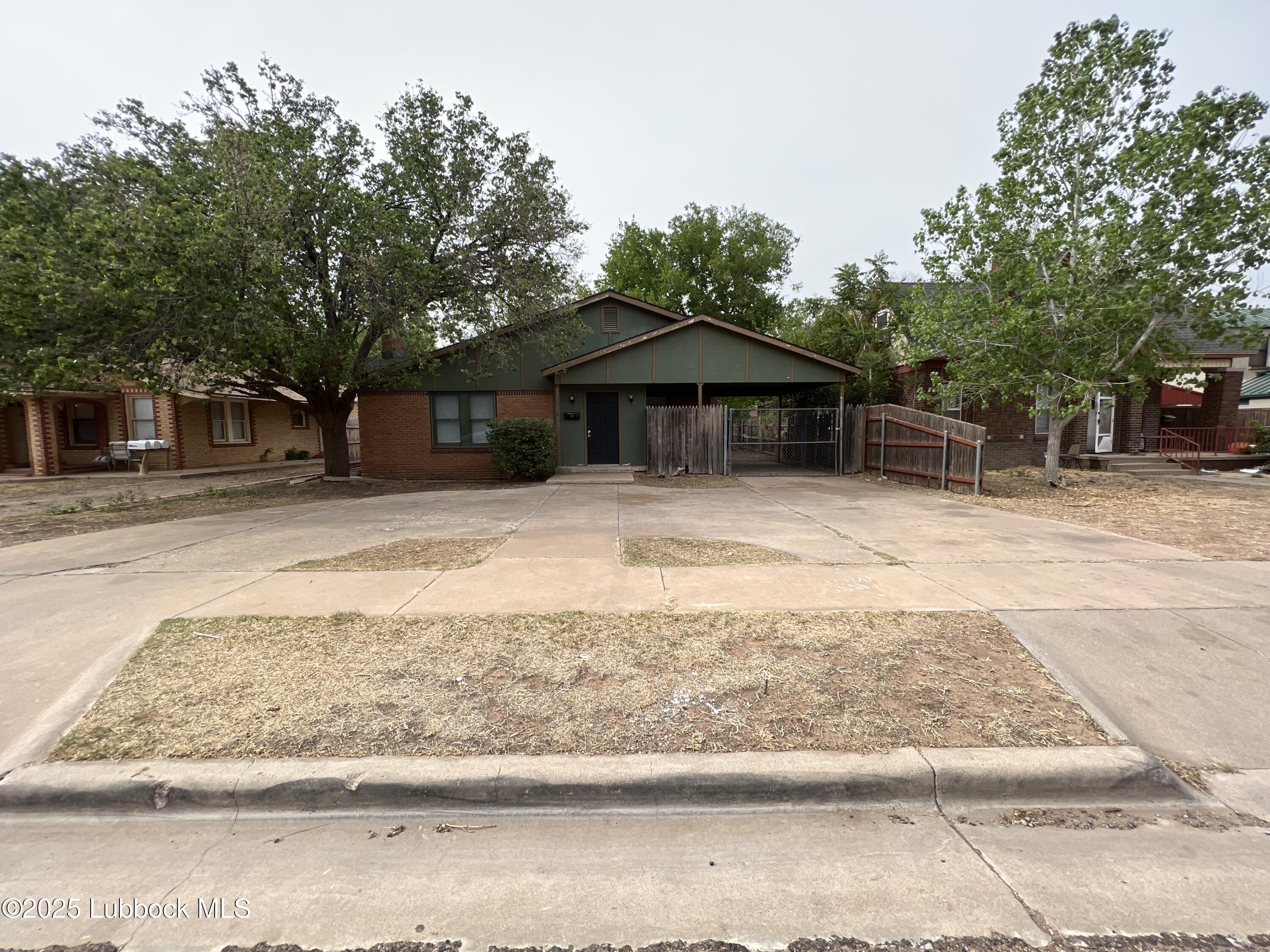 2318 18th Street Lubbock, TX 79401 - Photo 1 of 21 a backyard of a house