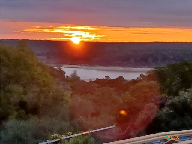 a view of an ocean and a mountain