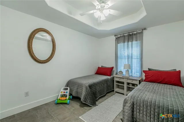 a bedroom with bed and a window