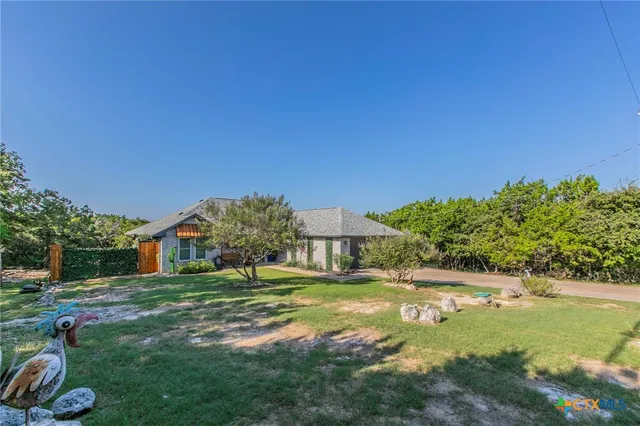 a view of a house with a big yard