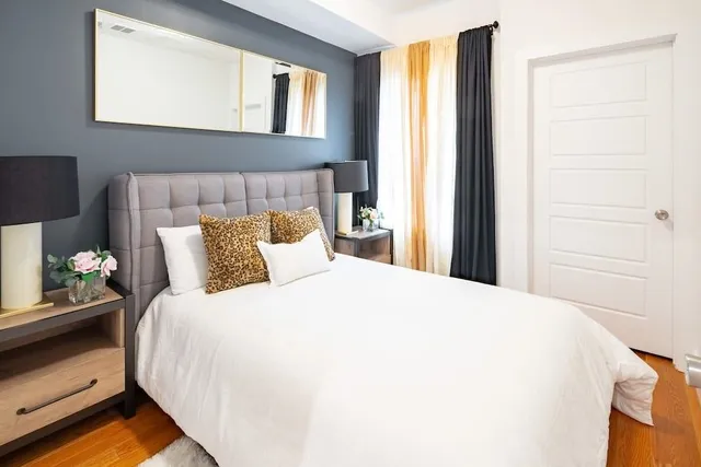 a bedroom with a bed and a window