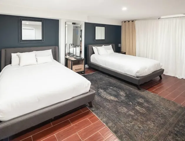 a bedroom with bed and window