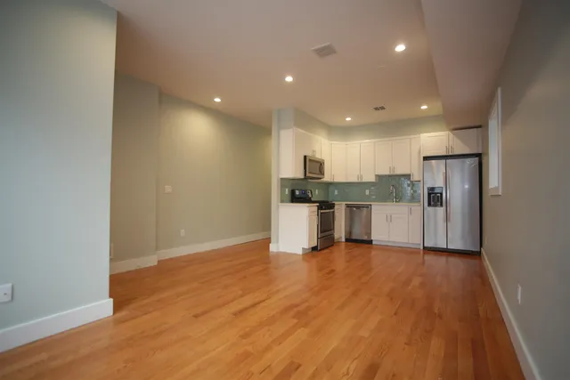 a view of kitchen with wooden floor