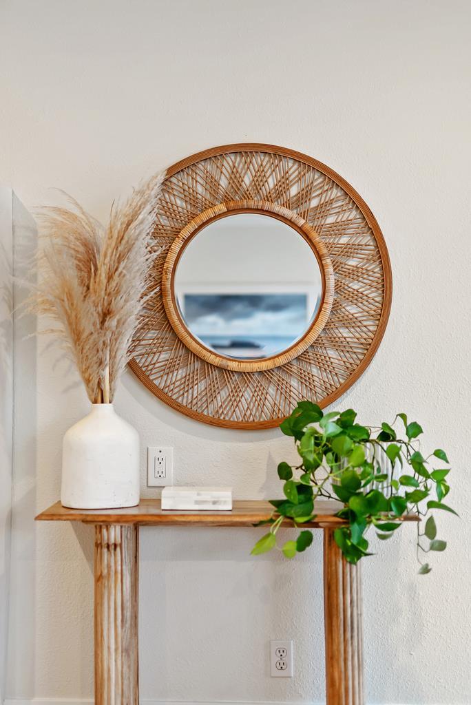 130 Hainline Road Aptos, CA 95003 - Photo 14 of 28 a vase of flowers sitting on a table with a mirror