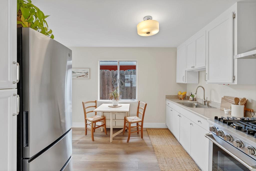 130 Hainline Road Aptos, CA 95003 - Photo 15 of 28 a view of a kitchen with a dining table and chairs
