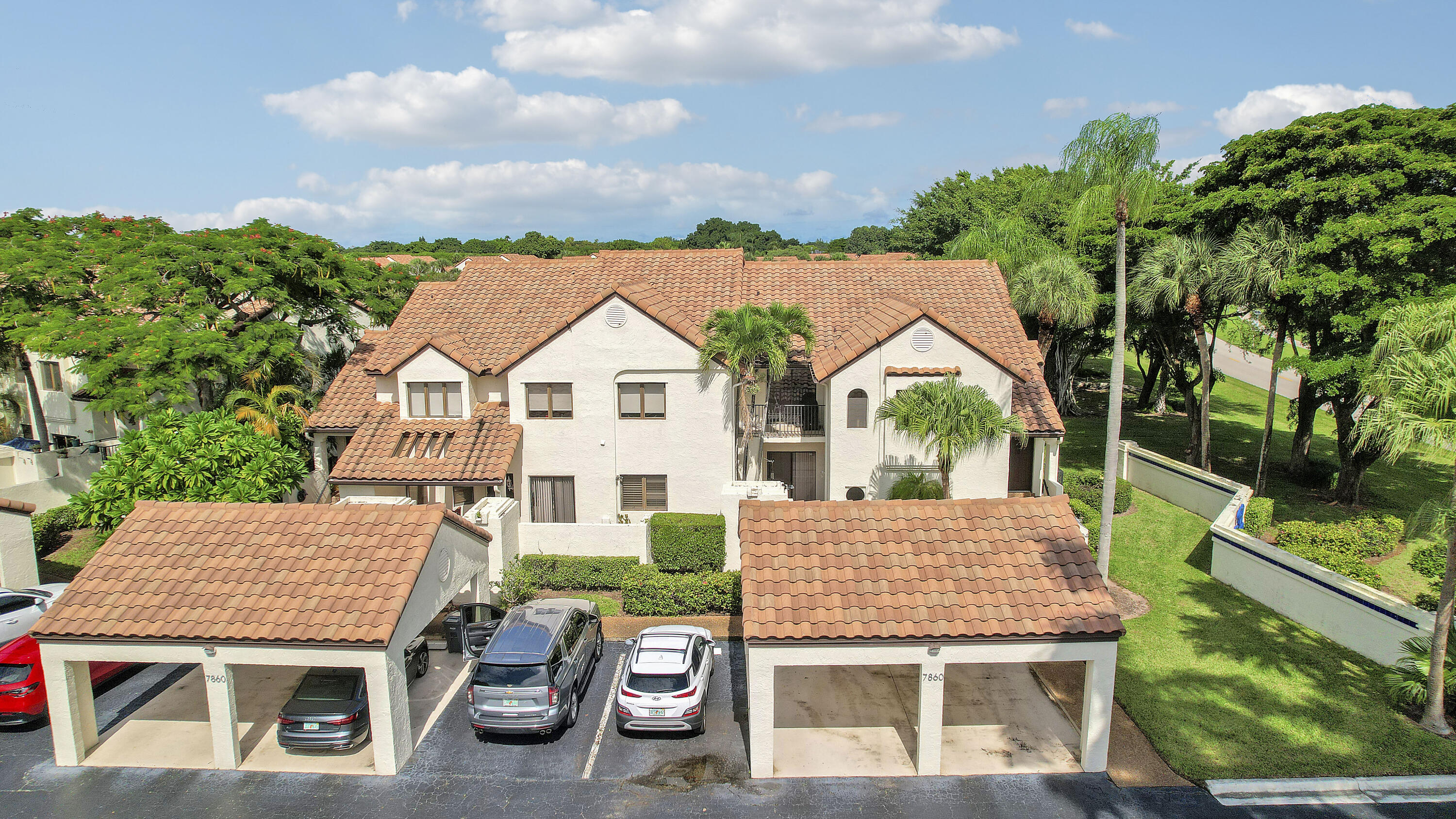 a view of house with backyard and outdoor seating