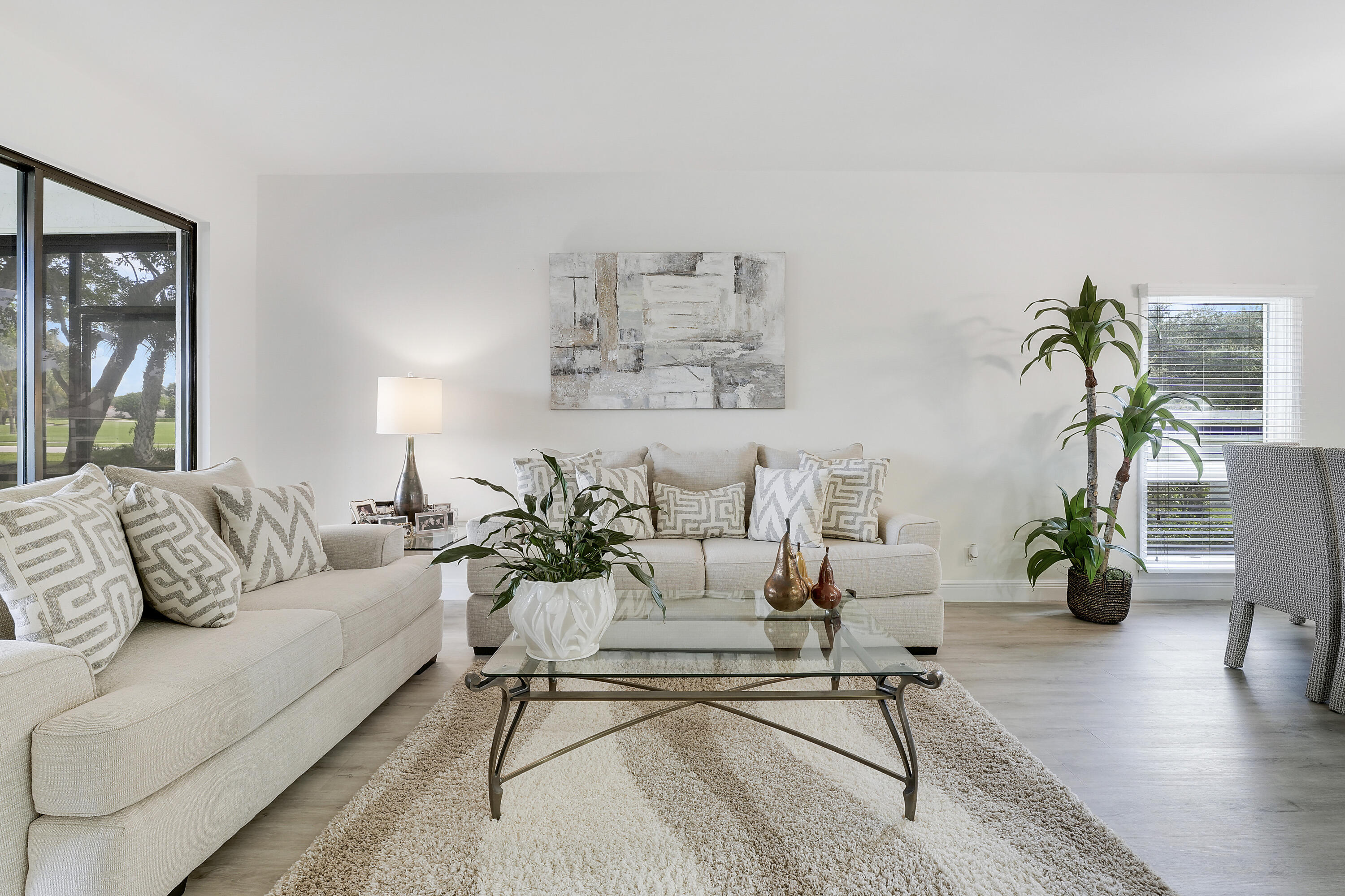 7860 Seville Place, Unit 2203 Boca Raton, FL 33433 - Photo 12 of 43 a living room with furniture and wooden floor