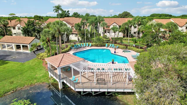 an aerial view of residential building and lake