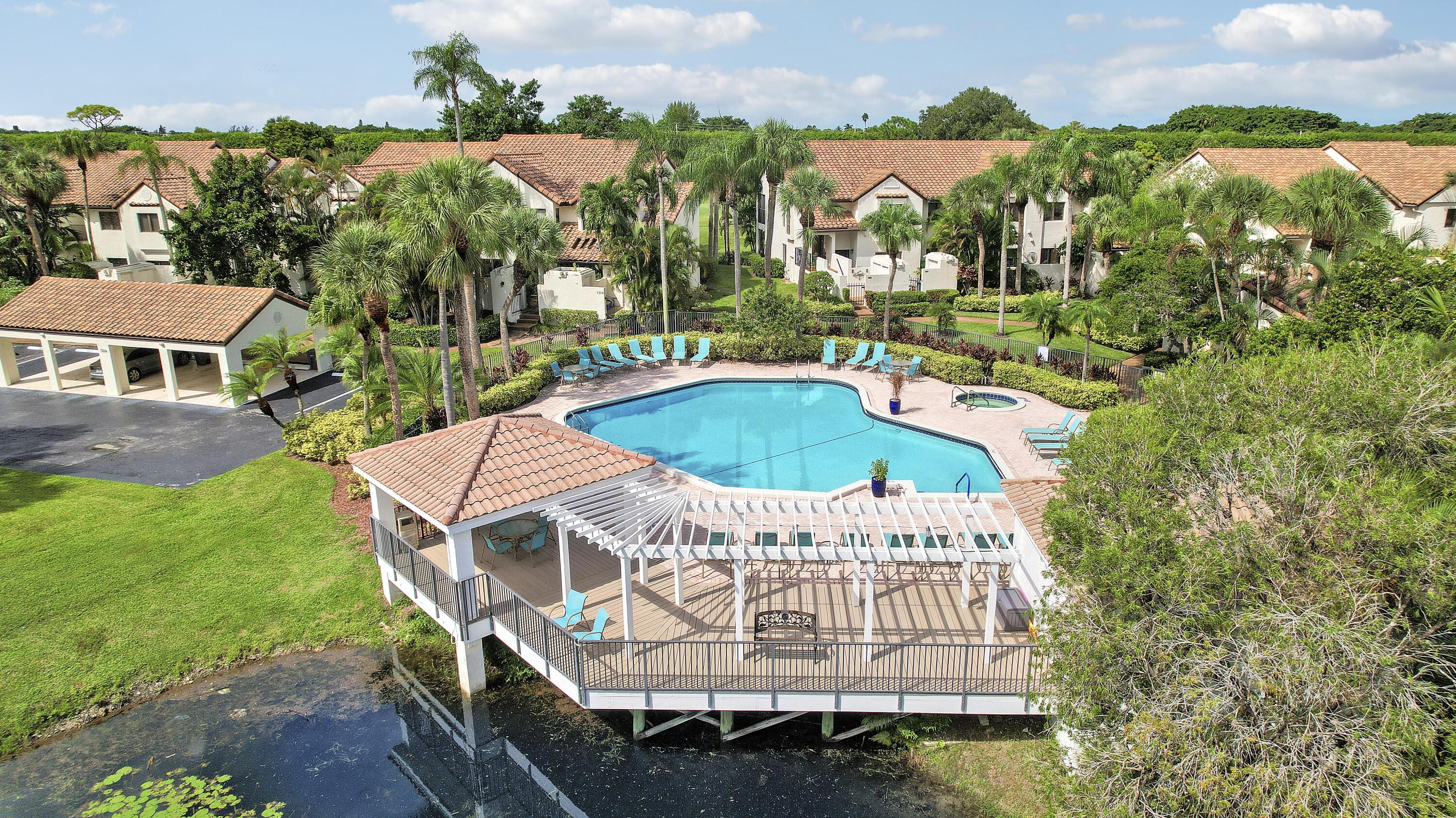 7860 Seville Place, Unit 2203 Boca Raton, FL 33433 - Photo 33 of 43 an aerial view of a house with swimming pool patio and outdoor seating