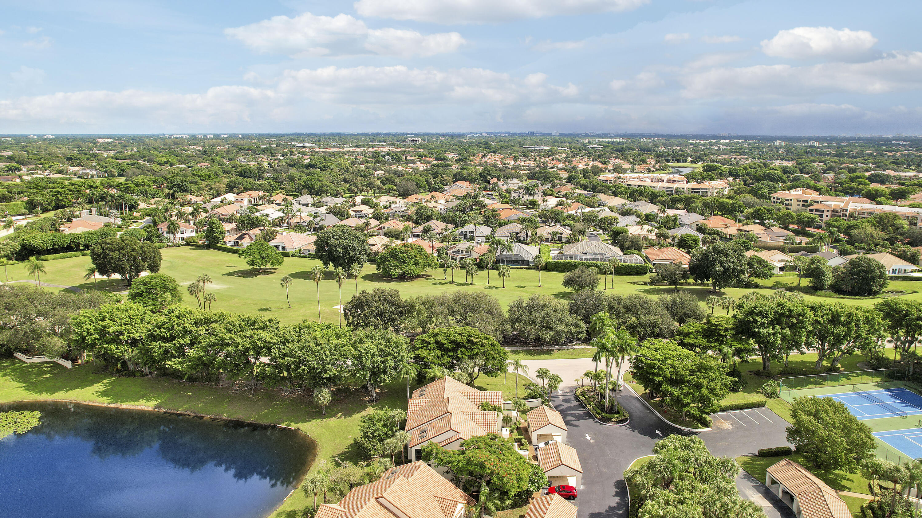 7860 Seville Place, Unit 2203 Boca Raton, FL 33433 - Photo 35 of 43 an aerial view of residential building and lake