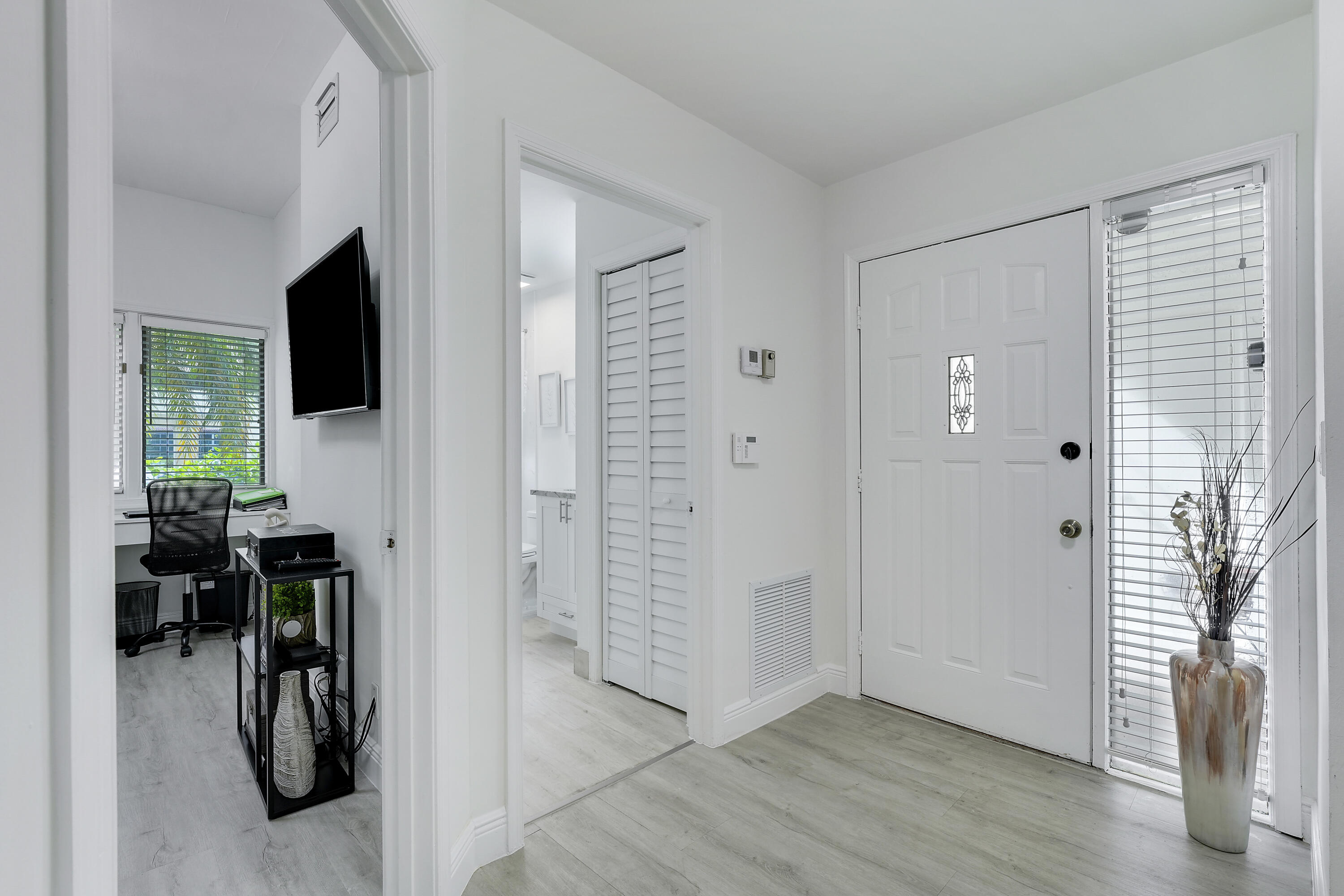 7860 Seville Place, Unit 2203 Boca Raton, FL 33433 - Photo 4 of 43 a view of a livingroom with wooden floor and windows